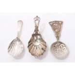Georgian silver caddy spoon with shell bowl and bright cut decorated stem (marks rubbed),