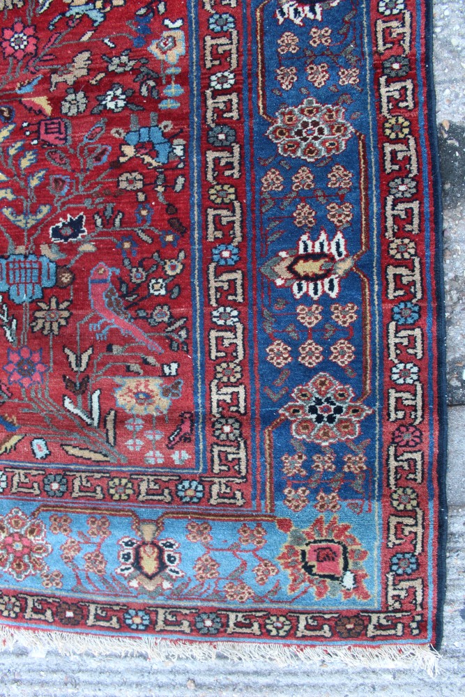 Kashan silk Tree of Life rug with blood-red field in blue meander main border, tassel ends, - Image 2 of 3