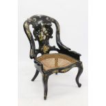 Mid-Victorian black papier máché and abalone inlaid spoon back chair with elaborate floral ornament,