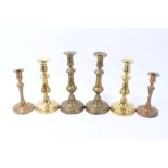 Three pairs of 18th / 19th century brass candlesticks,
