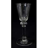 Early 18th century wine glass with conical bowl, double-knopped stem with air-bubble,