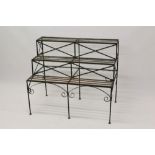 Green painted metal tiered floor-standing garden rack with three stepped slatted tiers,