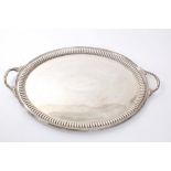 Late Victorian silver tray of oval form, with deep fluted border and reeded rim,