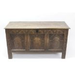 18th century and later carved oak coffer with triple arcade carved panel front and internal candle