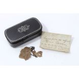 A Memento of Queen Caroline: Georgian black lacquer and pewter inlaid snuff box containing a