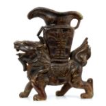 Chinese carved hardstone figure of a temple lion, archaic style urn on his back,