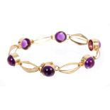 18ct gold and cabochon amethyst bracelet with six round amethyst cabochons interspersed by polished