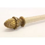 Antique curtain pole with gilt gesso pineapple terminals,