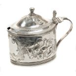 George III silver mustard pot of oval form, with embossed floral decoration,