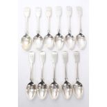 Eleven matching Victorian provincial silver fiddle pattern dessert spoons with engraved initials