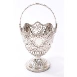 Victorian silver sugar basket of urn form, with pierced floral decoration and bead border,