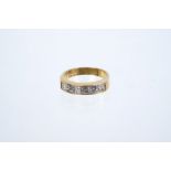 18ct gold diamond eternity ring with a half hoop of 6 emerald cut diamonds in channel setting,