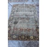 Antique silk Tree of Life rug with urn issuing meandering foliage in formal floral border,