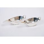 Pair 1930s Art Deco-style sauce boats of elongated form, with scroll handles,