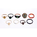 An interesting group of nine antique rings - to include an antique black enamel ring with green