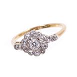 1920s diamond cluster ring with a central old cut diamond in an openwork crossover setting of