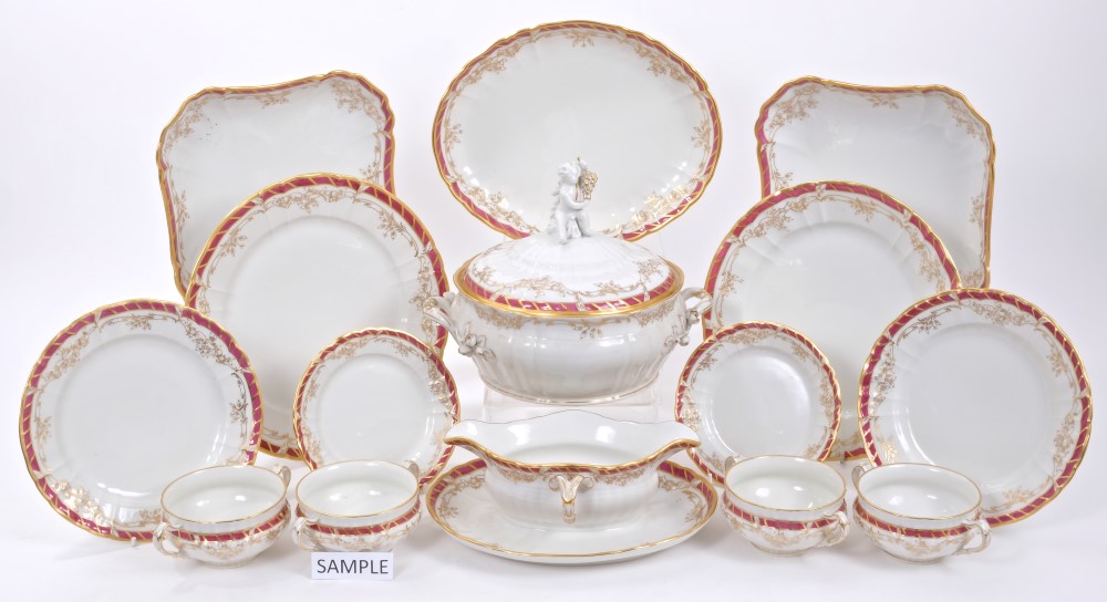 Impressive 19th century Berlin porcelain dinner service with red and gilt bands of gilt floral swag