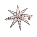 Late Victorian diamond star brooch with graduated old cut diamonds in silver setting,