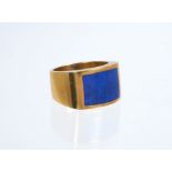 18ct gold ring with a lapis lazuli panel, on wide gold shank.