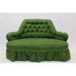 Victorian button-back corner settee with arched back, on cabriole legs and castors,