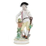 18th century Derby figure of a gardener, circa 1780, with flower pots, spade and marrow,
