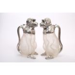 Matched pair of Edwardian silver mounted claret jugs in the form of seated monkeys,