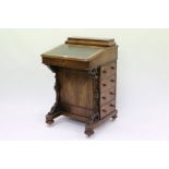 Victorian walnut Davenport desk with rear stationery compartment and large leather insert over four