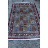 Mood rug with compartmented foliate ornament in animal borders 195cm x 128cm