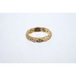 18ct gold wedding ring with plaited design and set with 12 brilliant cut diamonds,