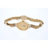 Ladies' Bulova Quartz 9ct gold wristwatch on 9ct gold multi-strand bracelet CONDITION