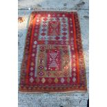 Kelim rug with two geometric compartments in geometric borders and tassel ends,