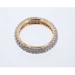 Diamond eternity ring with a full band of pavé set brilliant cut diamonds in 14ct gold setting.