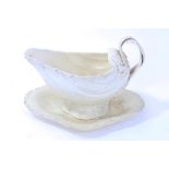 Rare late 18th century Czech Prager creamware sauce boat and stand of moulded shell form,