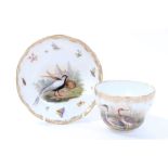 19th century Meissen tea cup and saucer with outside decorated polychrome painted bird,
