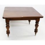 Early Victorian mahogany extending dining table with moulded rounded rectangular top on turned