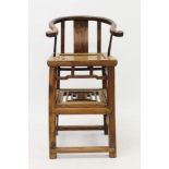 Antique Chinese elm and hardwood child's chair with horseshoe top rail, roundel carved splat back,