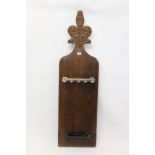 19th century carved oak poppy-head pew end adapted as a snooker cue stand,