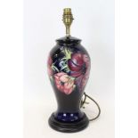 Moorcroft Pottery table lamp decorated in the Anemone pattern on blue ground,