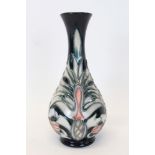 Moorcroft Pottery vase decorated in the Snakeshead pattern on blue ground,