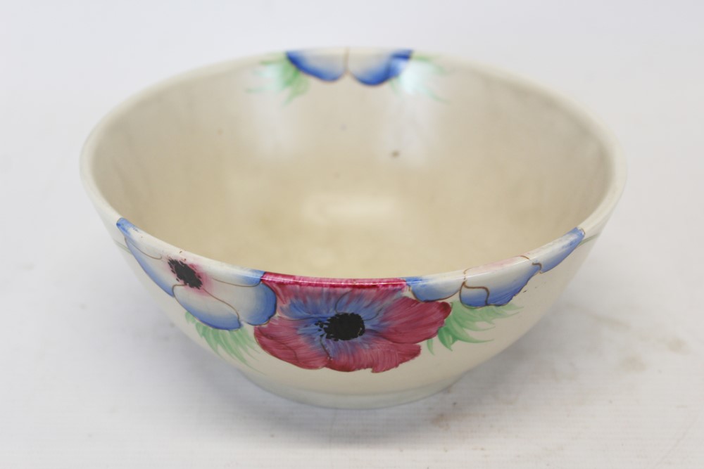 Clarice Cliff bowl with floral decoration on cream ground - printed marks to base,