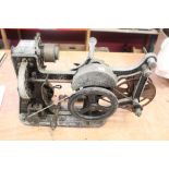 Very early film projector with crank handle