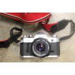 Cameras and photographic equipment - including a Canon AE1 SLR with 50mm lens and accessories and a