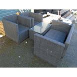 A cube form patio suite with canvas type upholstery, comprising two seater sofa, two elbow chairs