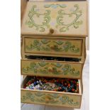 A painted wood miniature bureau containing a large quantity of assorted costume jewellery