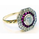 An Art Deco style marked .750 yellow metal ring, set with central diamond, inner pave set band of