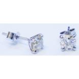 A pair of 18ct. white gold diamond stud earrings - approx. 1.5ct. TDW