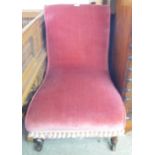 A Victorian walnut framed nursing chair with later old rose velour upholstery and tassel fringe, set