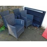 A suite of Jardin Netherlands BV woven plastic patio furniture comprising table and four elbow