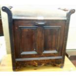 An early 20th Century stained walnut piano stool with upholstered drop-in seat panel, flanking