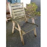 A set of eight teak folding garden chairs - sold with a teak garden chair